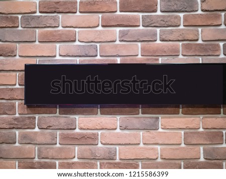Sign on a brick wall