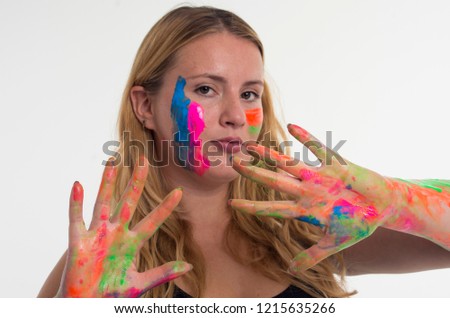 Young Girl in Colorful Paint on White Background