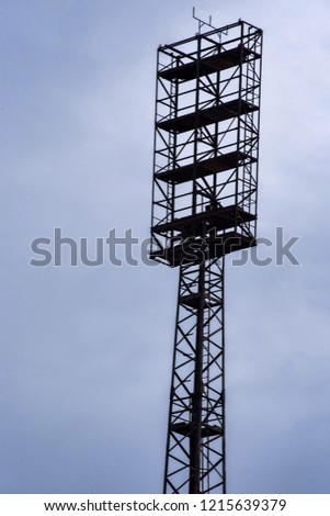 An old floodlight mast in a football stadium