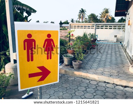 Sign toilet and arrow to toilet direction 
