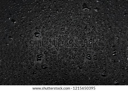 Water drops on a black background, closeup texture