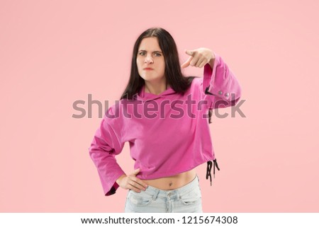 I choose you and order. Overbearing business woman point you, want you, half length closeup portrait on pink studio background. The human emotions, facial expression concept. Front view. Trendy colors