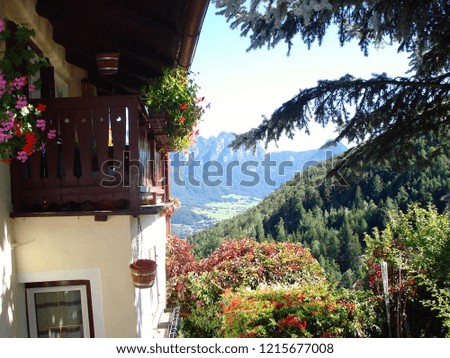 Beautiful Mountain Chalet in Summer with a view through the valley                       