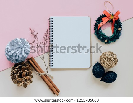 Creative flat lay of craft and blank notebook mock up on colorful background, top view