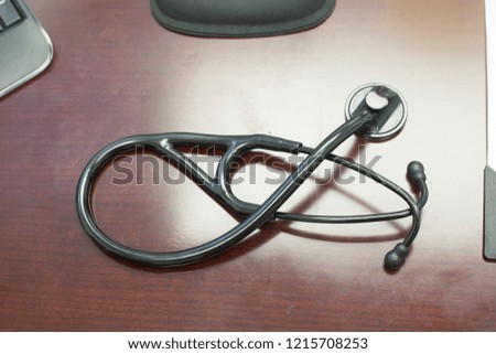 A stethoscope on a desk.