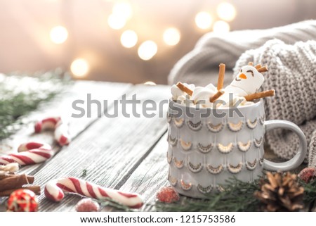 Christmas cocoa concept with marshmallows on a wooden background in a cozy festive atmosphere