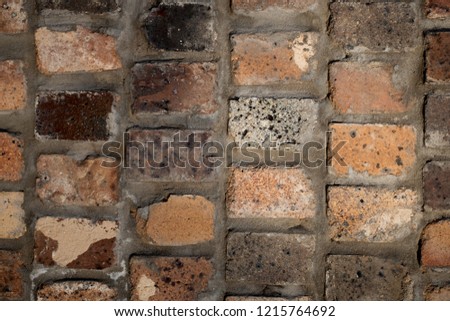 Unique brick wall made of mixed materials 
