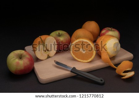 Creative surreal still life of apples and oranges
