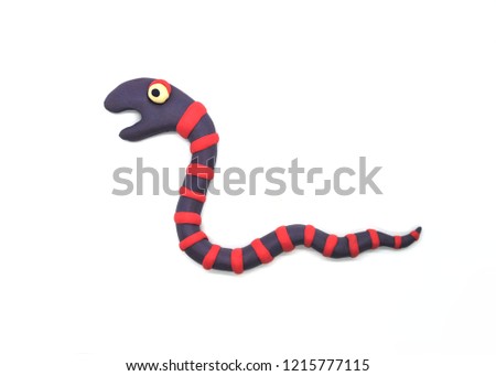 Funny striped cartoon worm on a white background. Plasticine illustration Royalty-Free Stock Photo #1215777115