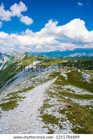 hiking path leading in the mountain range, julian alps