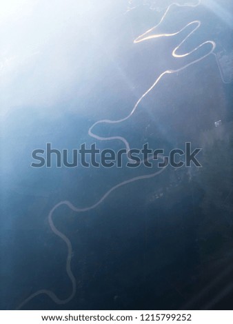 Blurred Aerial view of a long river from high angle view