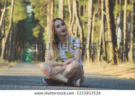 pine park, road in the forest, girl on the pavement, summer photo session in a pine park