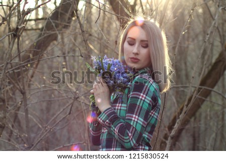 girl with flowers, on a background of flowers, sunflower, with a bouquet of roses, wild flowers