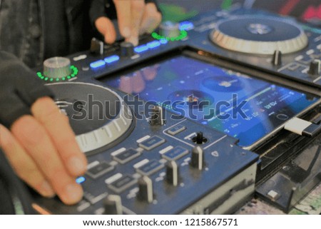 Party time DJ is using a mixer used in Electronic techno dupstep music