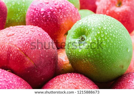 heap of fresh clean green and red apples with drops of water mix on black background, top side view closeup Royalty-Free Stock Photo #1215888673