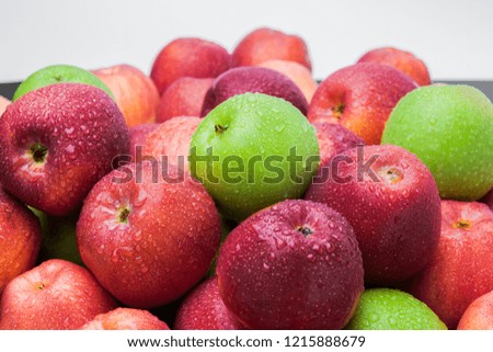 heap of fresh clean green and red apples with drops of water mix on black background, top side view closeup Royalty-Free Stock Photo #1215888679