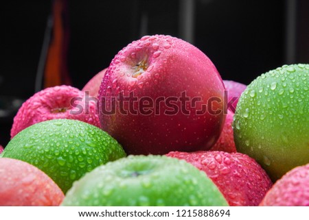 heap of fresh clean green and red apples with drops of water mix on black background, top side view closeup Royalty-Free Stock Photo #1215888694