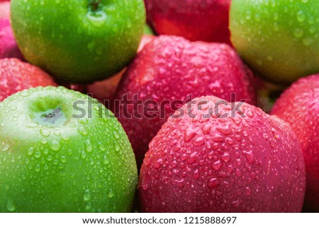 heap of fresh clean green and red apples with drops of water mix on black background, top side view closeup Royalty-Free Stock Photo #1215888697