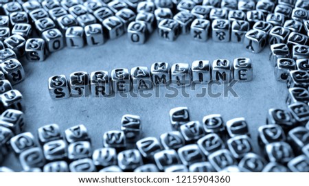 Streamline - Word from Metal Blocks on Paper - Concept Photo on Table
