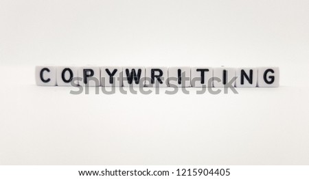 Copywriting word built with white cubes and black letters on white background