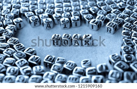 Hoax - Word from Metal Blocks on Paper - Concept Photo on Table
 Royalty-Free Stock Photo #1215909160