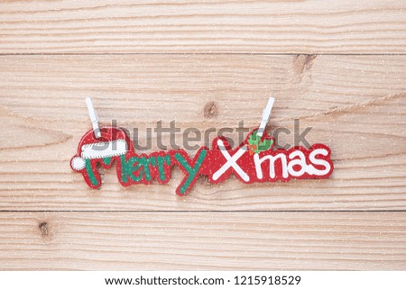 Merry Christmas word decoration on wooden floor, preparation for holiday concept, Happy New Year and Xmas Holidays