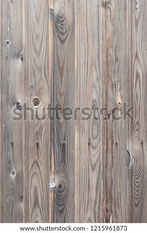 Old grunge dark brown wood panel pattern with beautiful abstract grain surface texture, vertical striped background or backdrop in architectural material decoration concepts, vintage or retro style