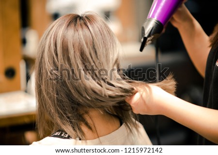 Hair dryer in salon shop. Close shot. vintage tone. warm tone.  Royalty-Free Stock Photo #1215972142