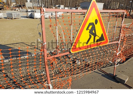Reconstruction of pedestrian footpath. Warning sign about road works