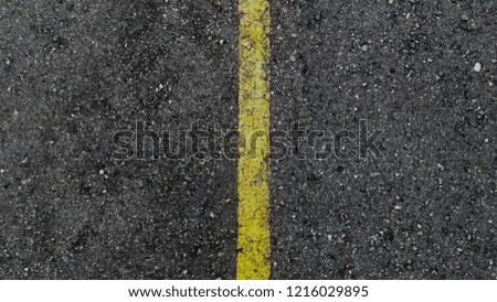 image of a road with a traffic sign drawn in the middle, of the yellow color.
