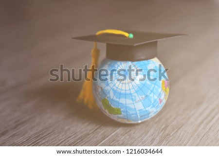 World global with black mortarboard education concept