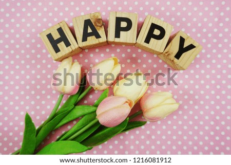 happy word made from wooden cubes with letters alphabet