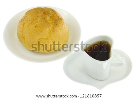 This is a photograph of a cream puff and coffee.