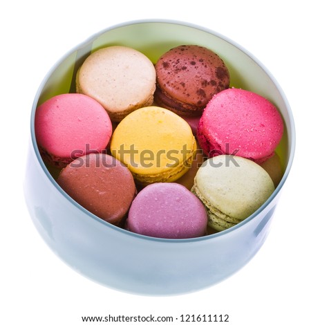 traditional french colorful macaroons put into a round cardboard box   isolated on white background