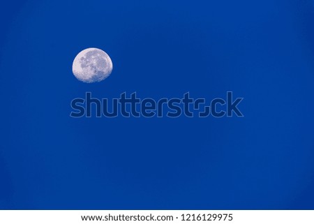 top left moon on blue sky