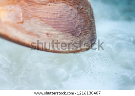 wooden spoon mixing