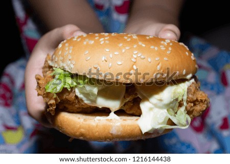 Girls with fast food hamburgers
