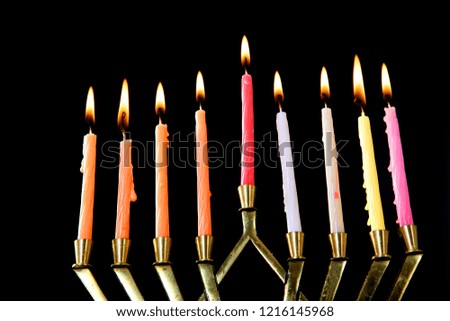 Candlestick with burning candles on a dark background