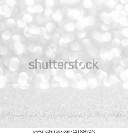silver and white bokeh lights abstract background