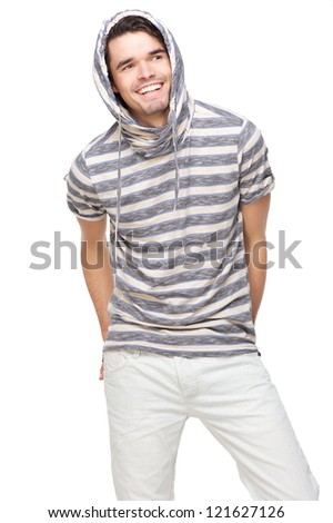 Smiling handsome man with hood over his head. Fashion model has hands in back pocket and wearing a striped hooded sweatshirt. Isolated on white background