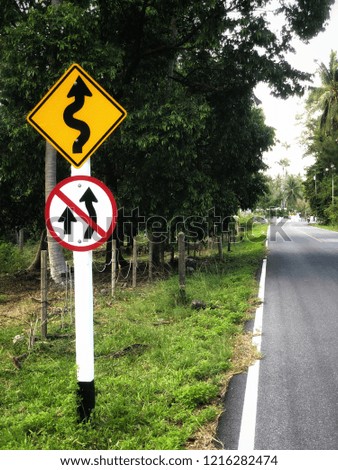 Traffic sign on the road or Traffic Sign and other traffic sign beside road with landscape in Thailand.