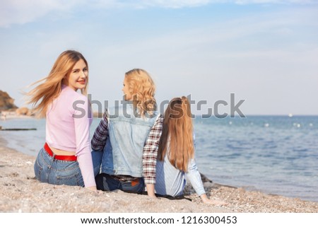 A picture of a group of women having fun on the beach