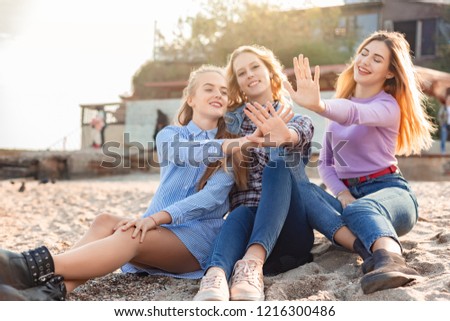 A picture of a group of women having fun on the beach