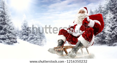 Old red santa claus and winter time. Landscape of trees and mountains. Free space for your decoration. 