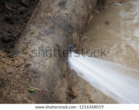 Water splashed from main pipe burst Royalty-Free Stock Photo #1216368019