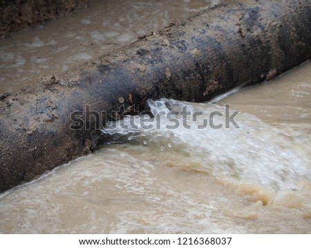 Water splashed from main pipe burst Royalty-Free Stock Photo #1216368037