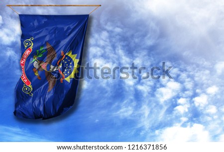 Flag State of North Dakota. Vertical flag, against blue sky with place for your text