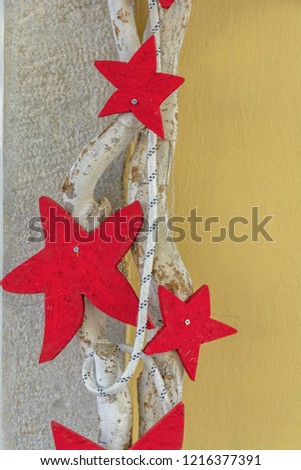New Year wooden decoration on rope on wall