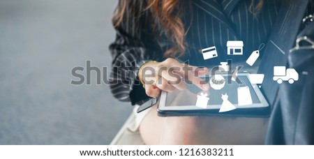 close up asian woman using tablet for choosing item in marketplace website with virtual interface of shopping online (b2b) technology concept Royalty-Free Stock Photo #1216383211