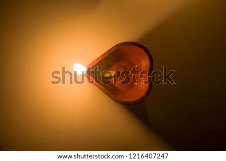 Top view picture of a lit lamp commonly used during the Indian festival of Diwali 